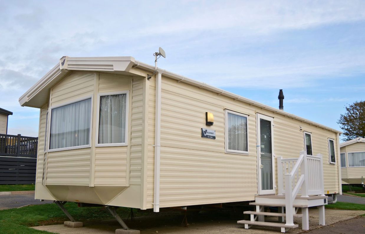 External of a caravan on pitch with steps