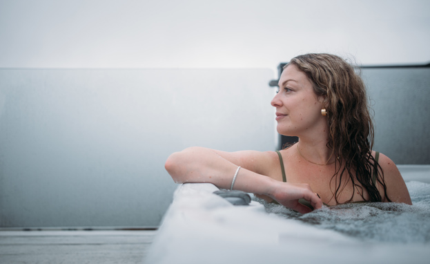 Woman relaxing in hot tub