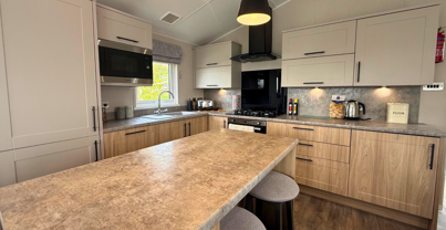 Internal of a caravan kitchen with breakfast bar