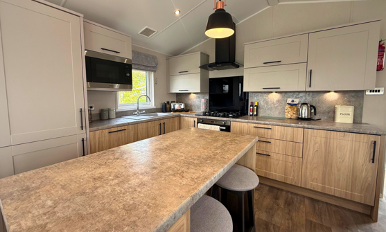 Internal of a caravan kitchen with breakfast bar