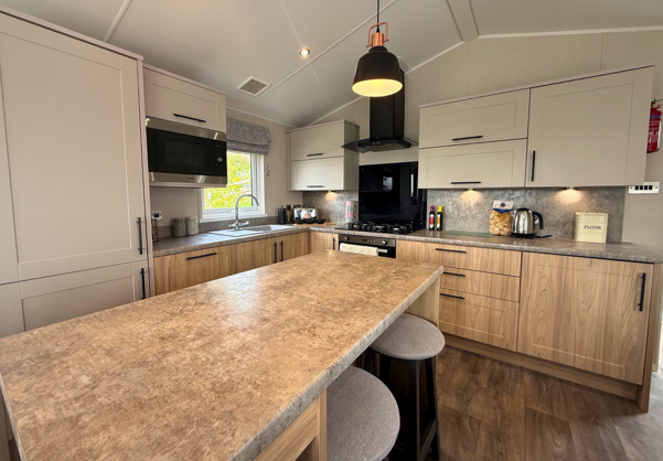 Internal of a caravan kitchen with breakfast bar