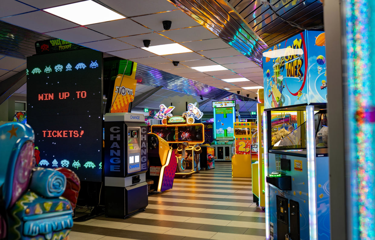 An indoor arcade with a variety of classic arcade games