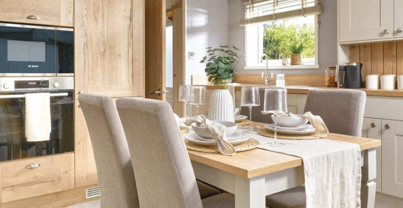 Internal of a caravan kitchen with dining table