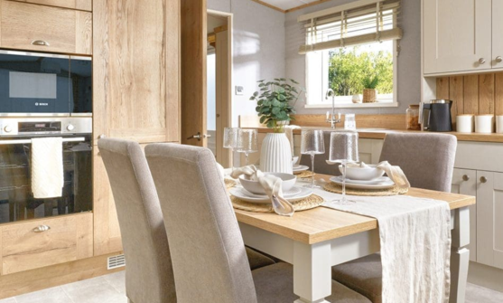 Internal of a caravan kitchen with dining table