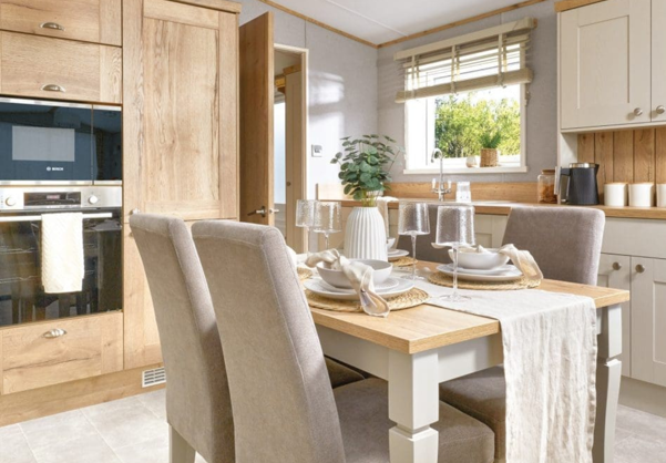 Internal of a caravan kitchen with dining table