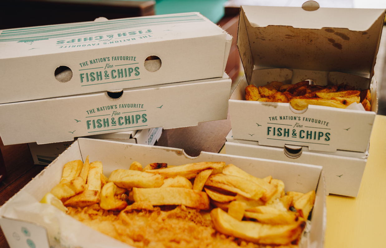 A selection of boxes of takeaway fish and chips