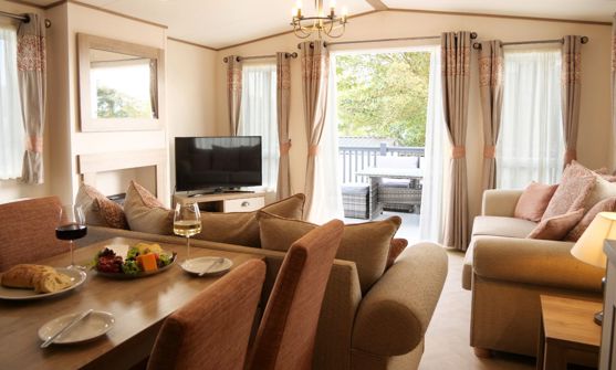 Internal of a caravan open plan living space out to decking