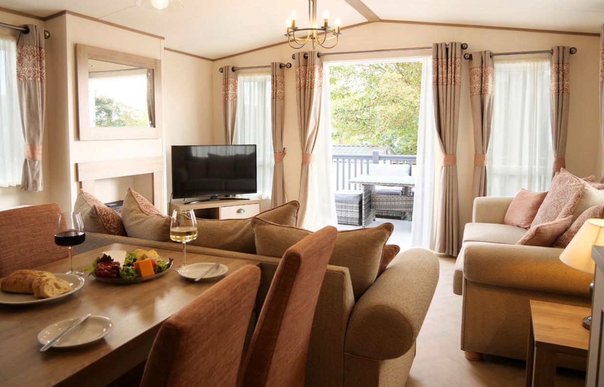 Internal of a caravan open plan living space out to decking