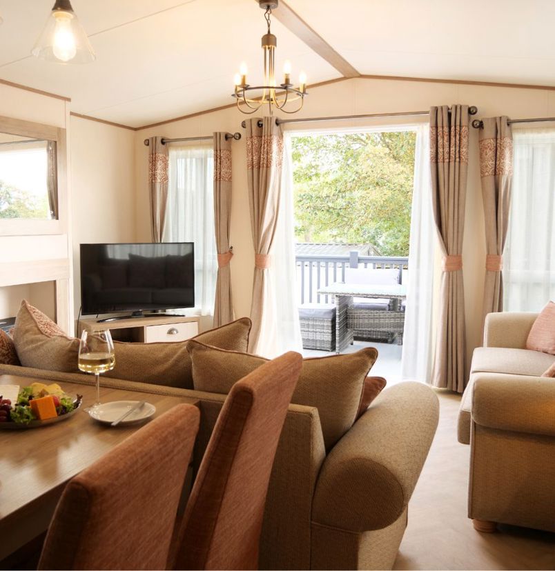 Internal of a caravan open plan living space out to decking