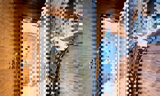 Outdoor shower connecting to internal bathroom