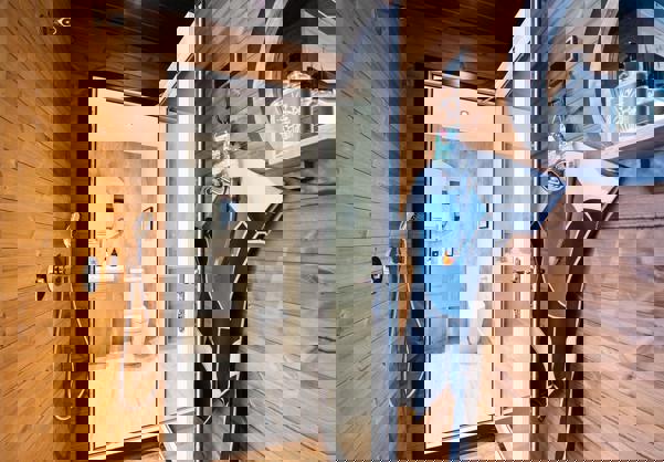 Outdoor shower connecting to internal bathroom