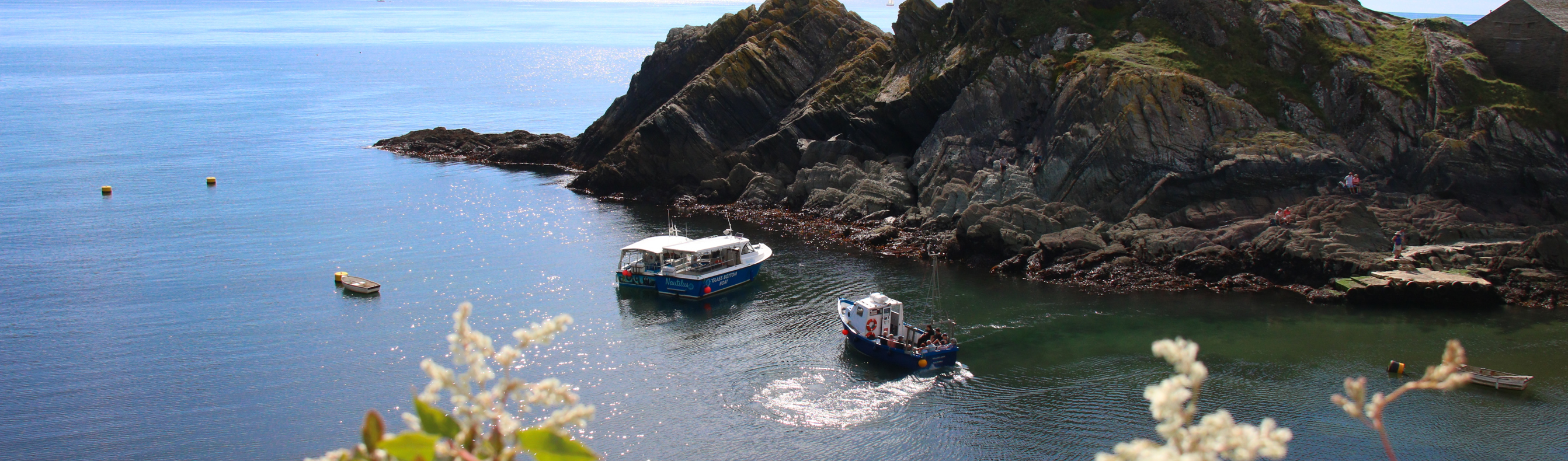 Boats off Polperro coastline