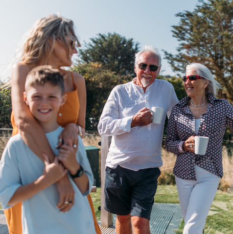 Grandparents with kids and grandkids on deck at the Stables
