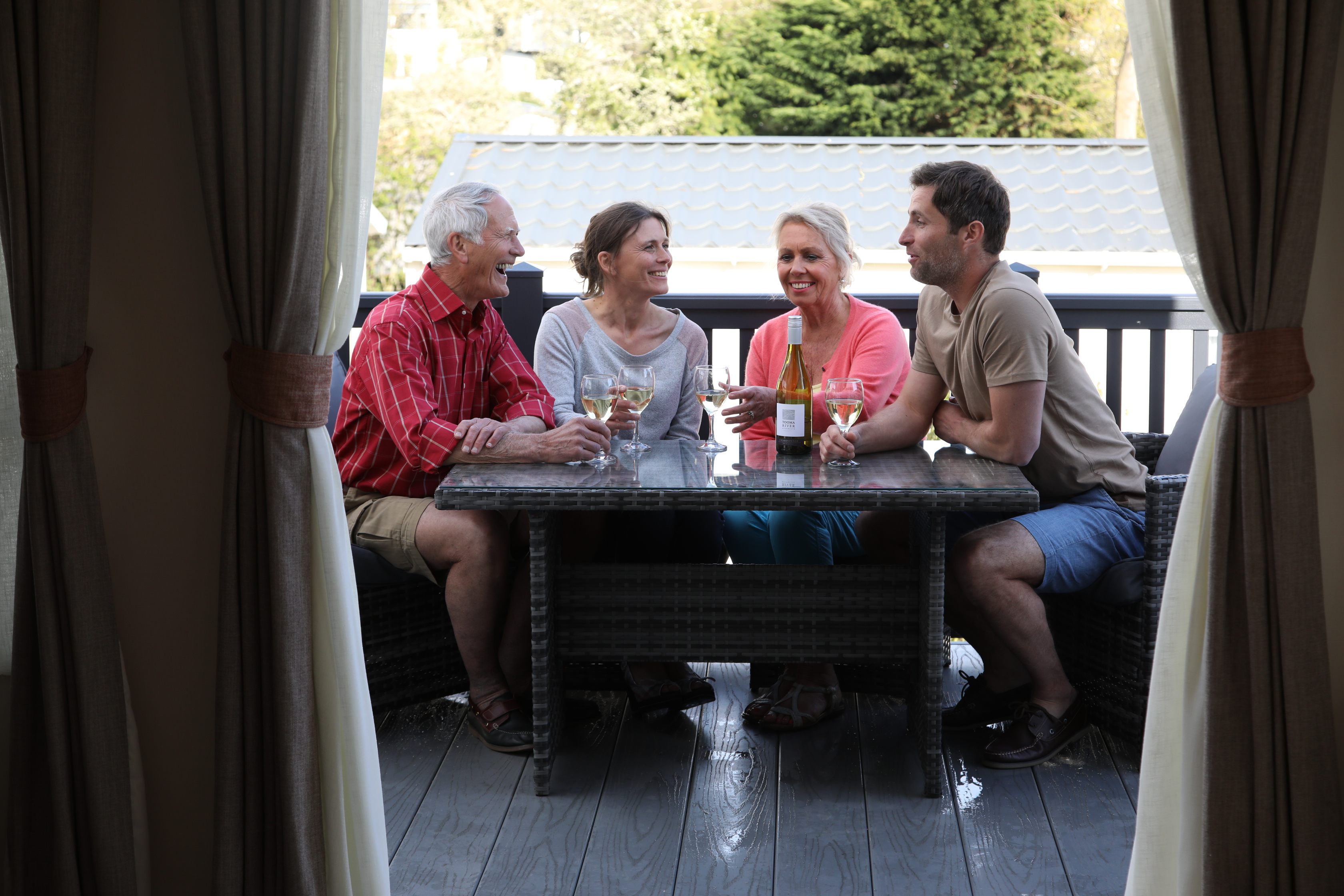 Family enjoying a drink on decking