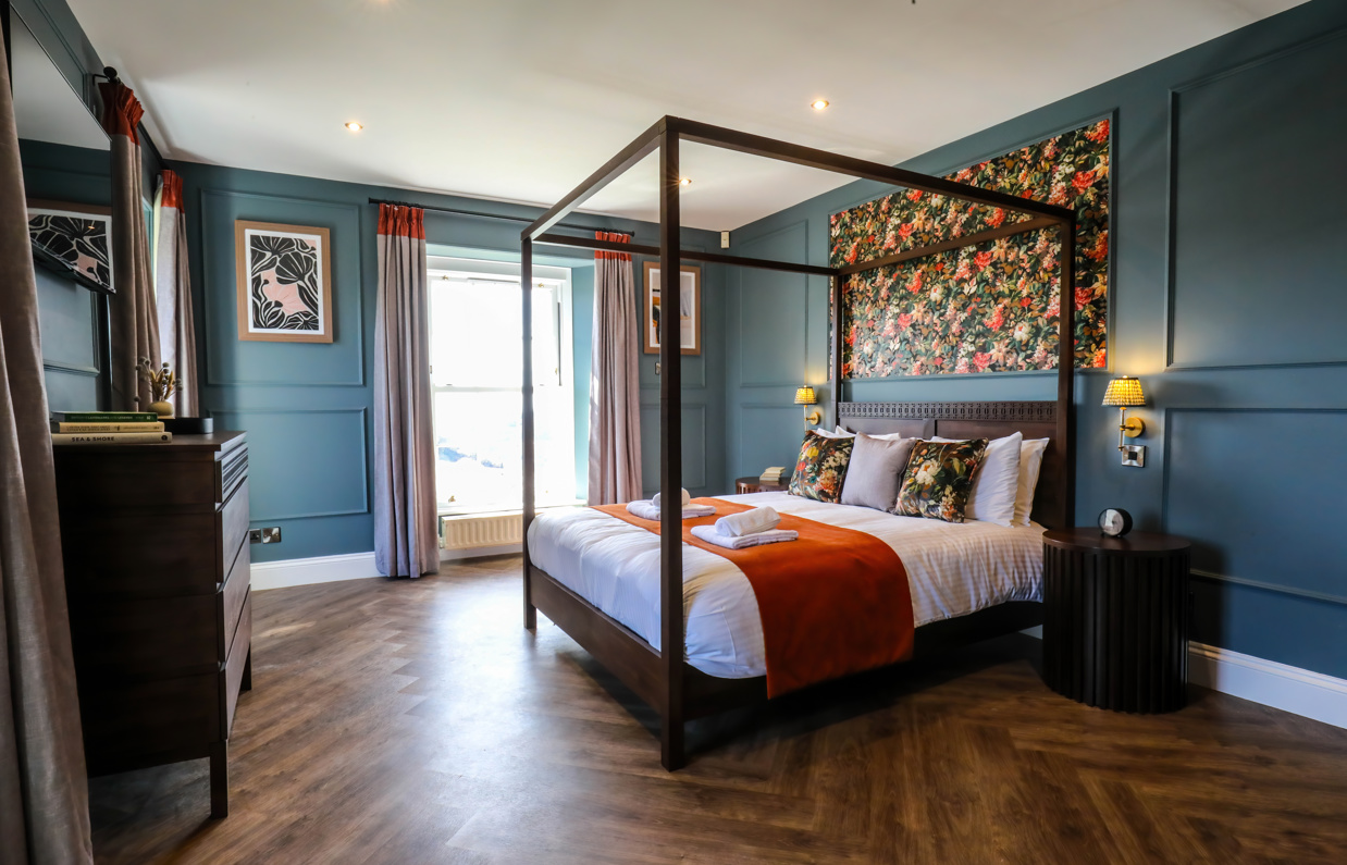 Internal of a manor house master bedroom with four poster bed 