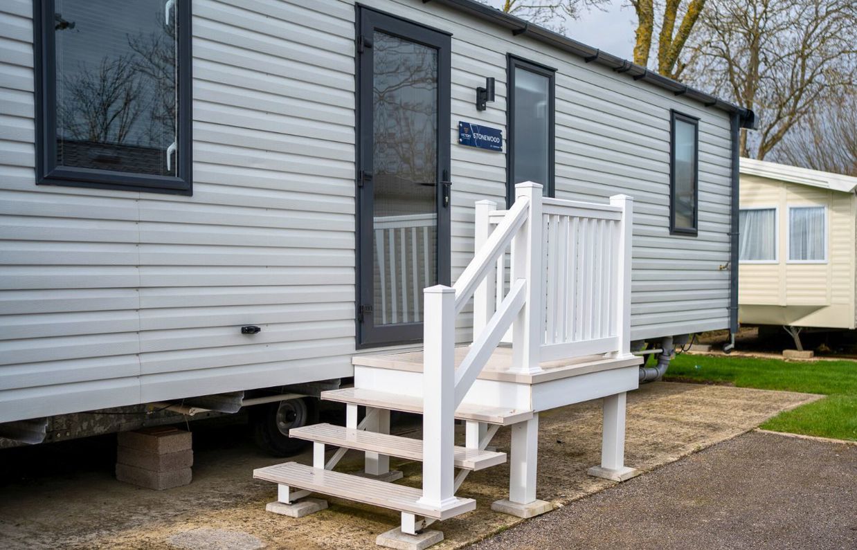 External of a caravan on pitch with steps