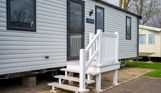 External of a caravan on pitch with steps
