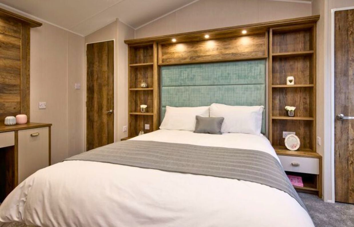 Internal of a caravan master bedroom with dressing area