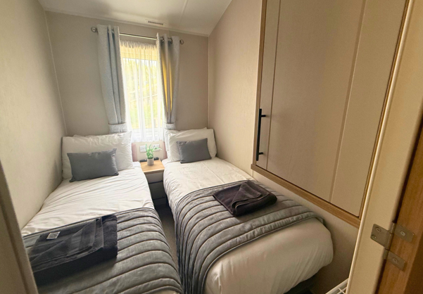 Internal of a caravan twin bedroom