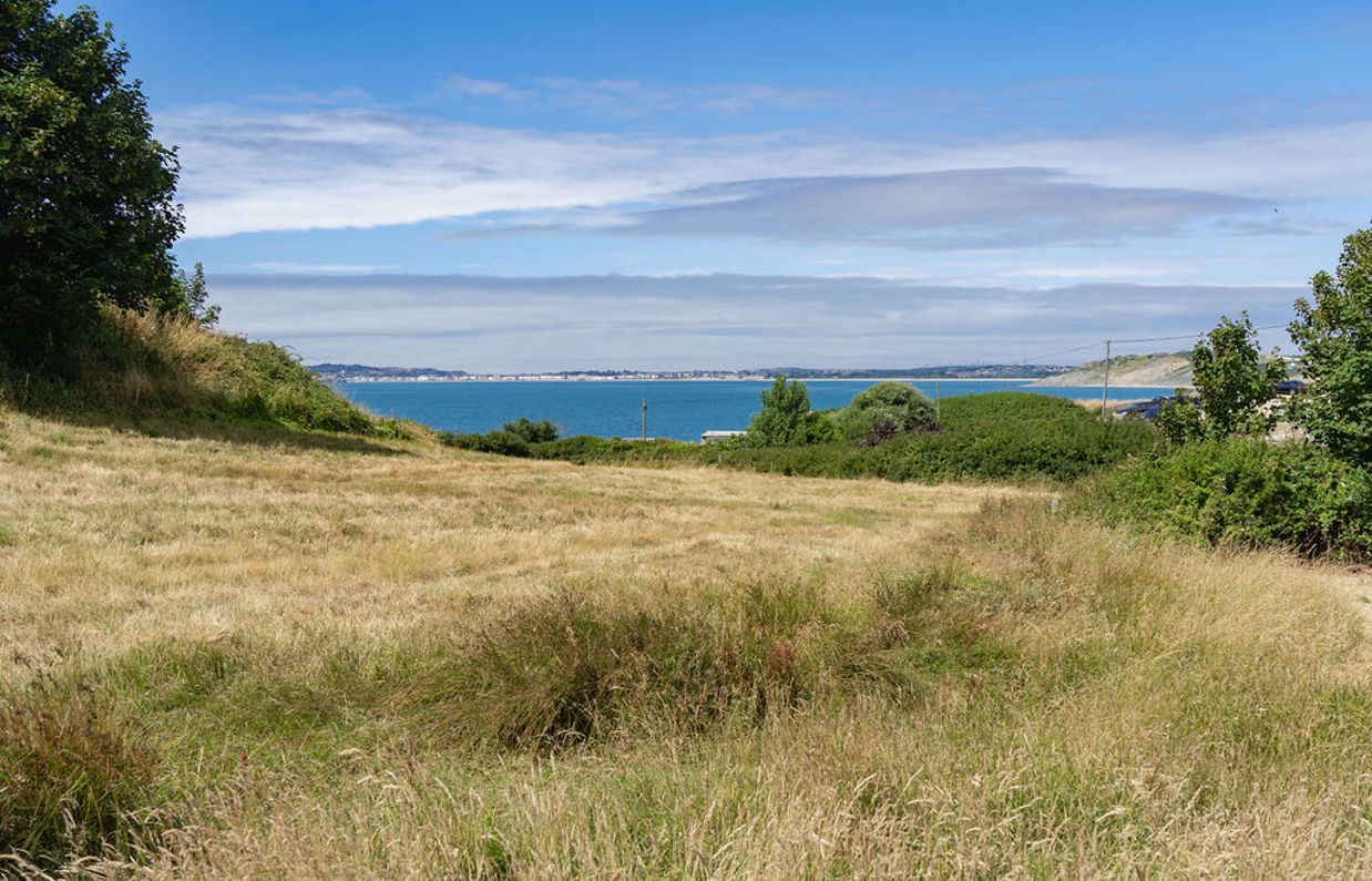 View of sea from countryside around Osmington Mills Lodge Park
