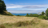 View of sea from countryside around Osmington Mills Lodge Park