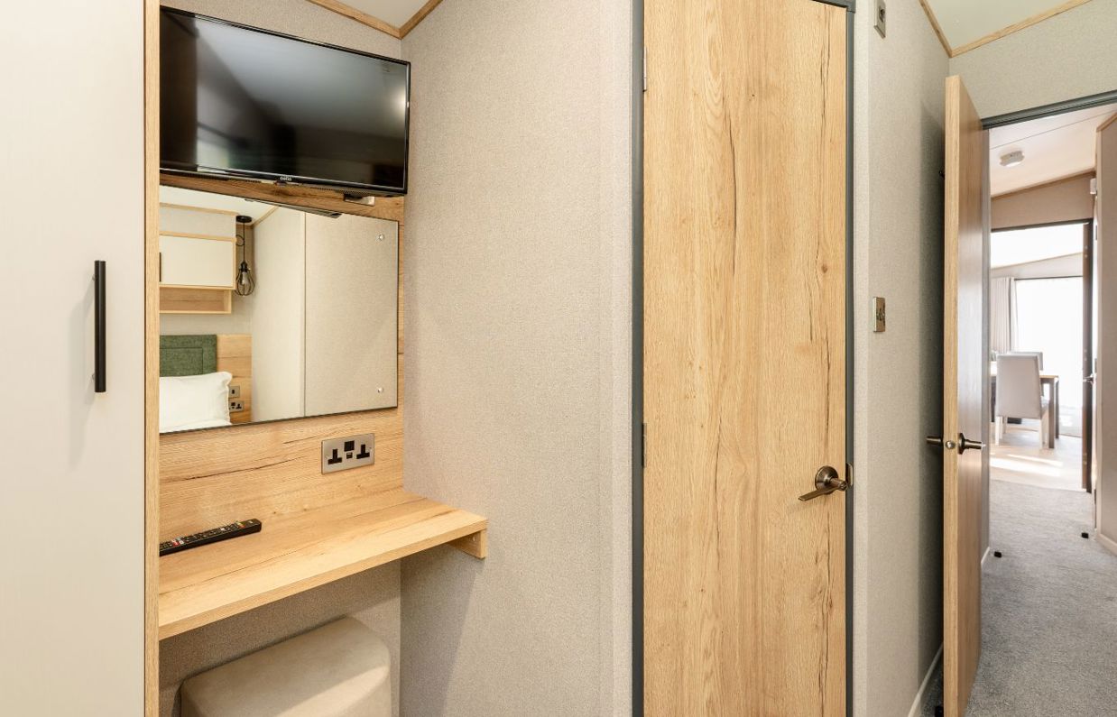 Internal of a caravan master bedroom storage, ensuite and dressing area