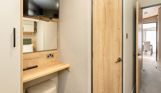 Internal of a caravan master bedroom storage, ensuite and dressing area