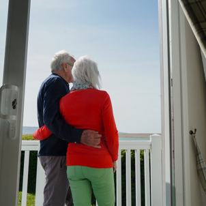 Chesil Beach Owners arm in arm on deck