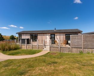 External of a cabin with decking 
