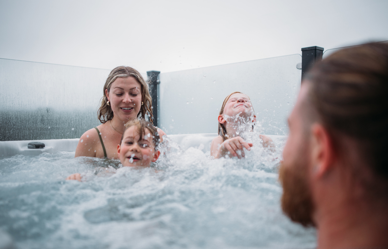 Family having fun in hot tub