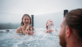 Family having fun in hot tub