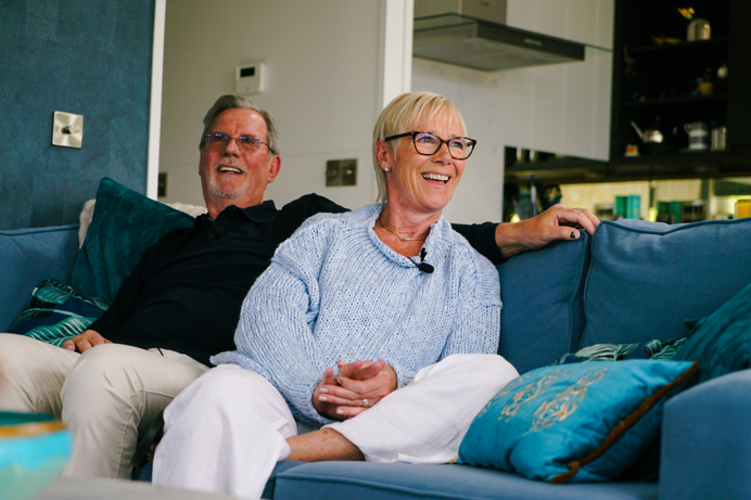 Stables Owners laughing on sofa