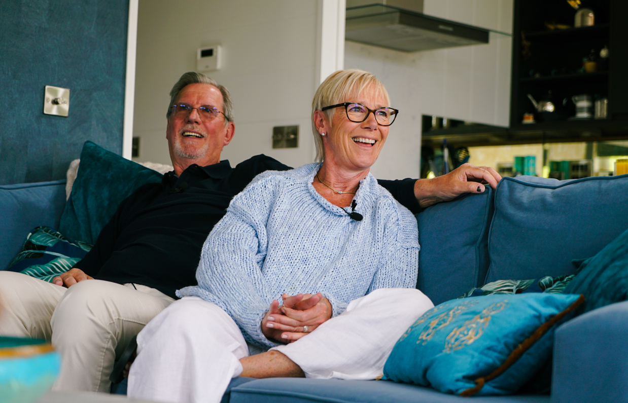 Stables Owners laughing on sofa
