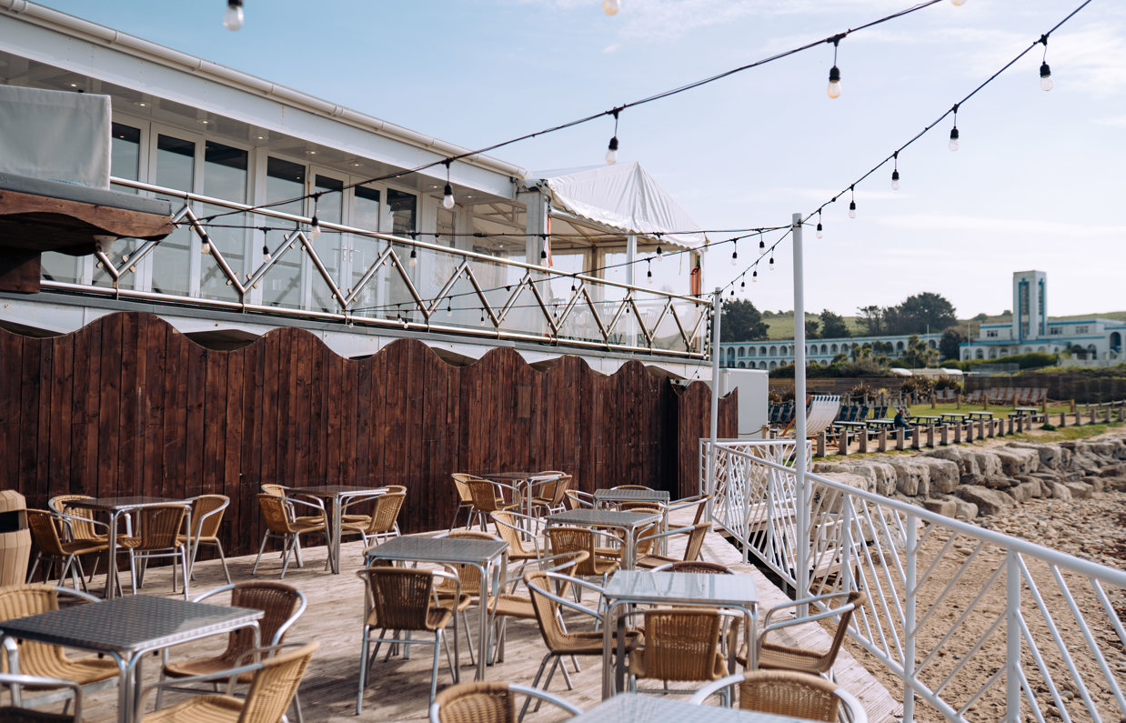 Beachside outdoor seating of Drift Bar & Grill