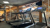 Inside of a modern gym facility with various equipment