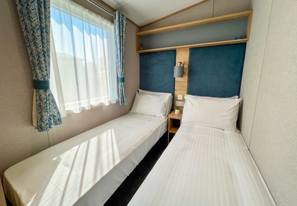 Internal of a caravan twin bedroom