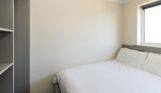 Internal of a Chesil Beach apartment double bedroom with storage