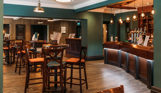 Internal of the country club restaurant and bar with a cosy moody atmosphere and plenty of chairs and tables