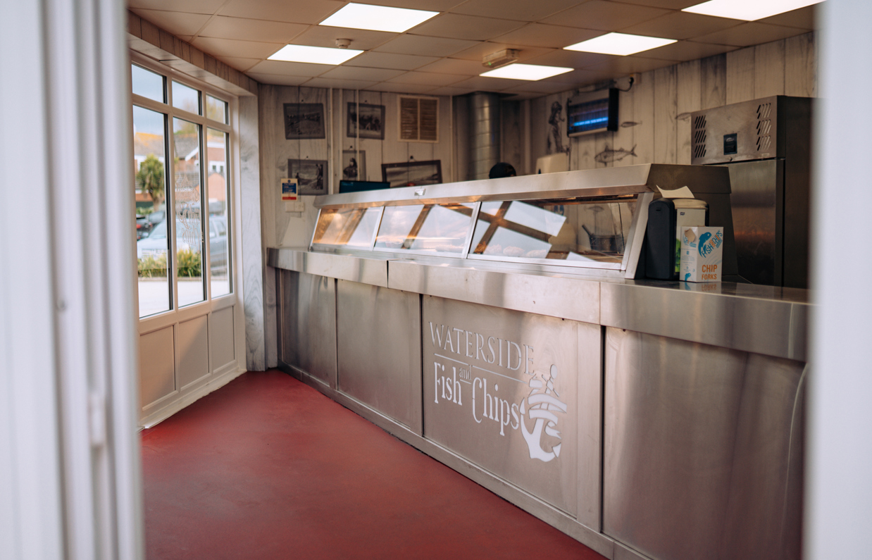 The inside of a fish and chip and pizza takeaway shop