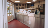 The inside of a fish and chip and pizza takeaway shop