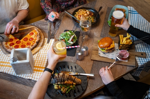 A Selection of Food Dishes including Burgers, Pizza, Fish and Noodles