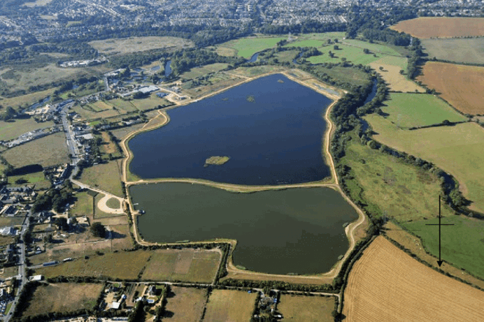 A large body of water surrounded by countryside as seen from above