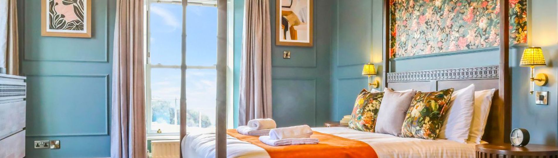 Internal of a manor house master bedroom with four poster bed 