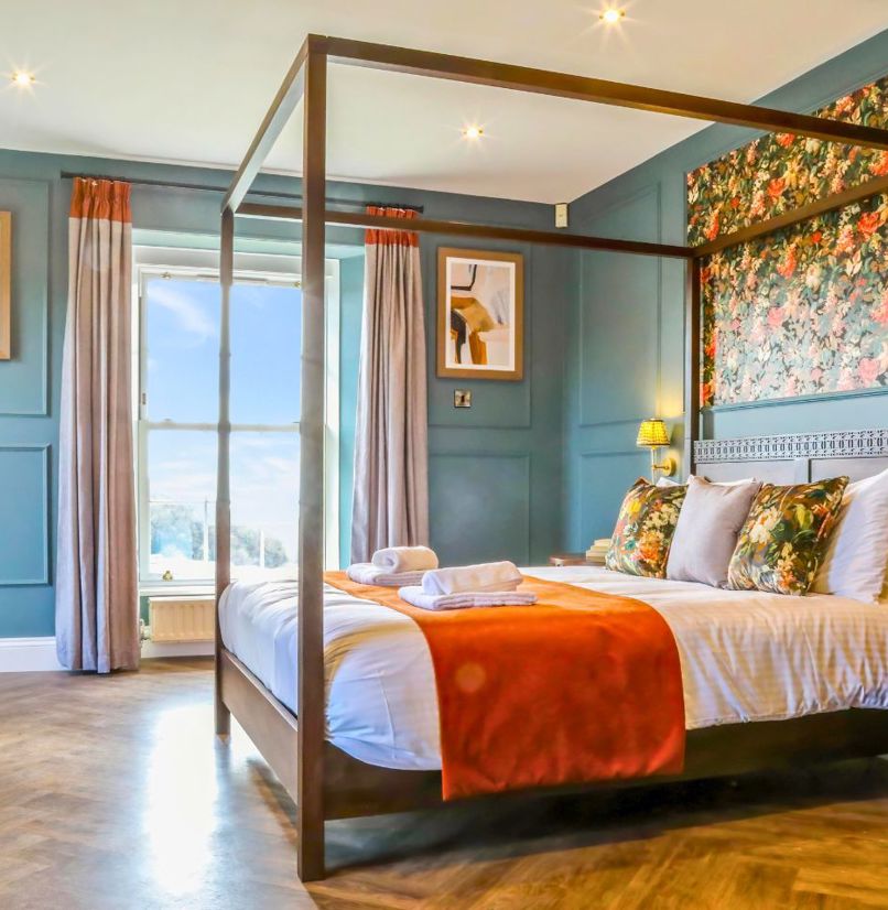 Internal of a manor house master bedroom with four poster bed 