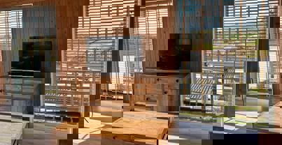 TV area in lounge with dark wooden furniture and decor