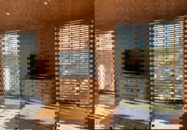 TV area in lounge with dark wooden furniture and decor