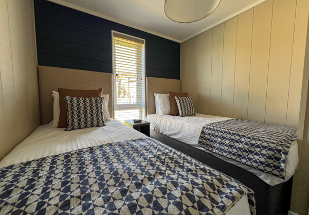 Internal of a luxury lodge twin bedroom