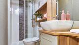 Internal of a caravan bathroom with shower, sink and toilet