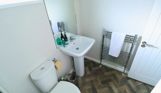 Internal of a caravan bathroom with toilet and sink