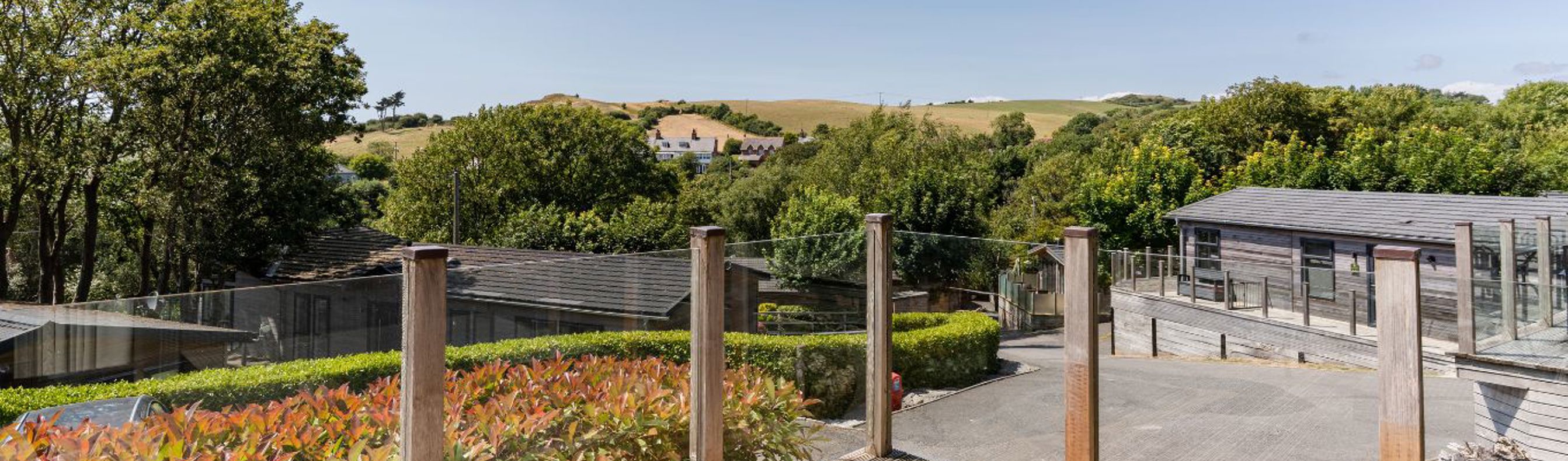 External of a lodge decking with countryside views